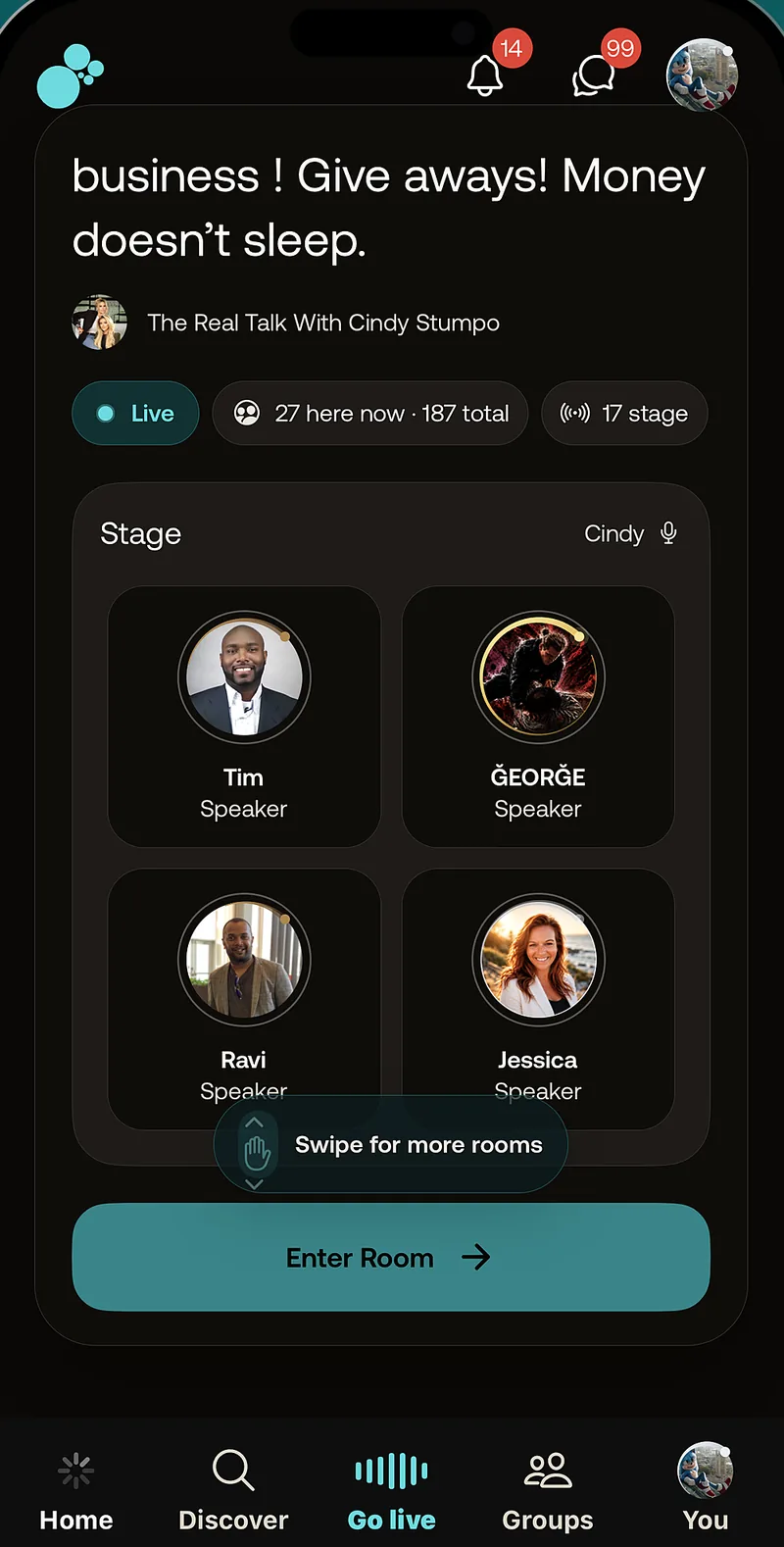 A live room with four speakers on stage and 187 people listening